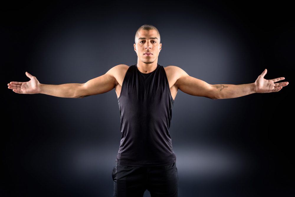 Man demonstrating shoulder rotation aqua therapy exercise