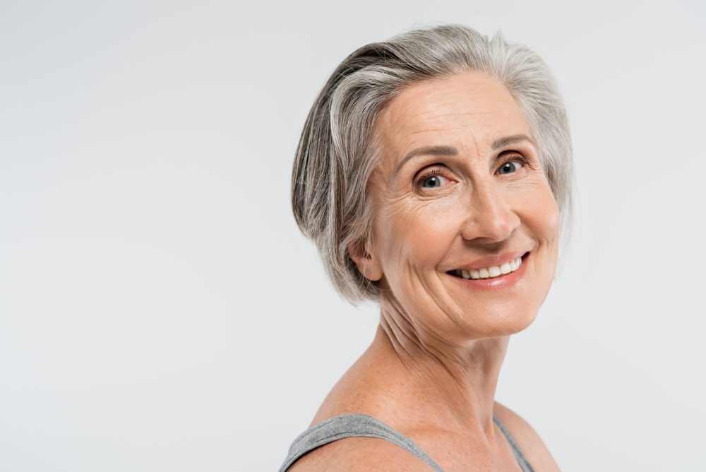 portrait of satisfied mature woman with grey hair